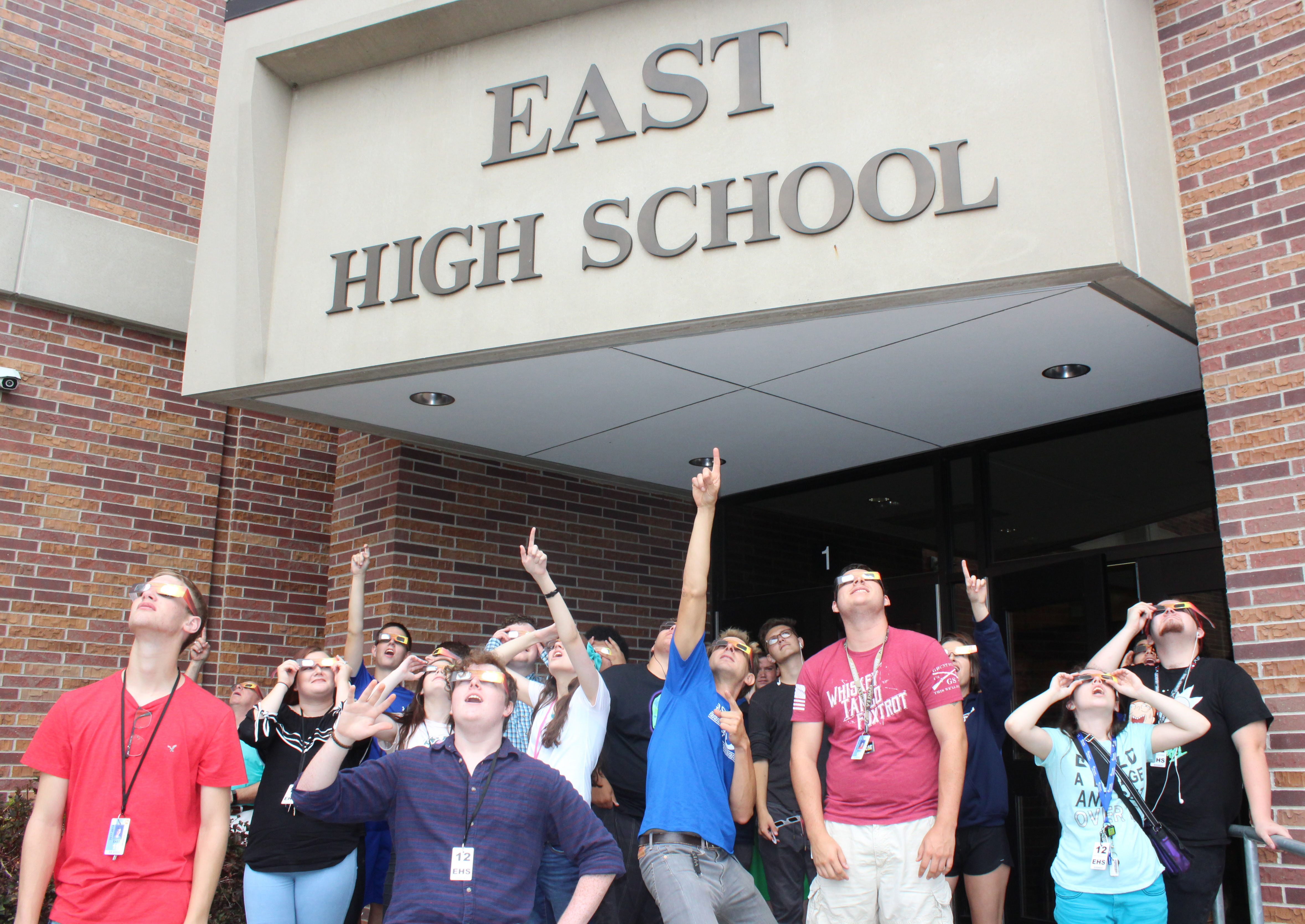Lincoln East science teacher Mr. Schmidt and his class take a break to gaze at the beginning of the eclipse on Monday, August 21st. All LPS schools took a break to watch the memorable event.
Photo by Nick Rippe