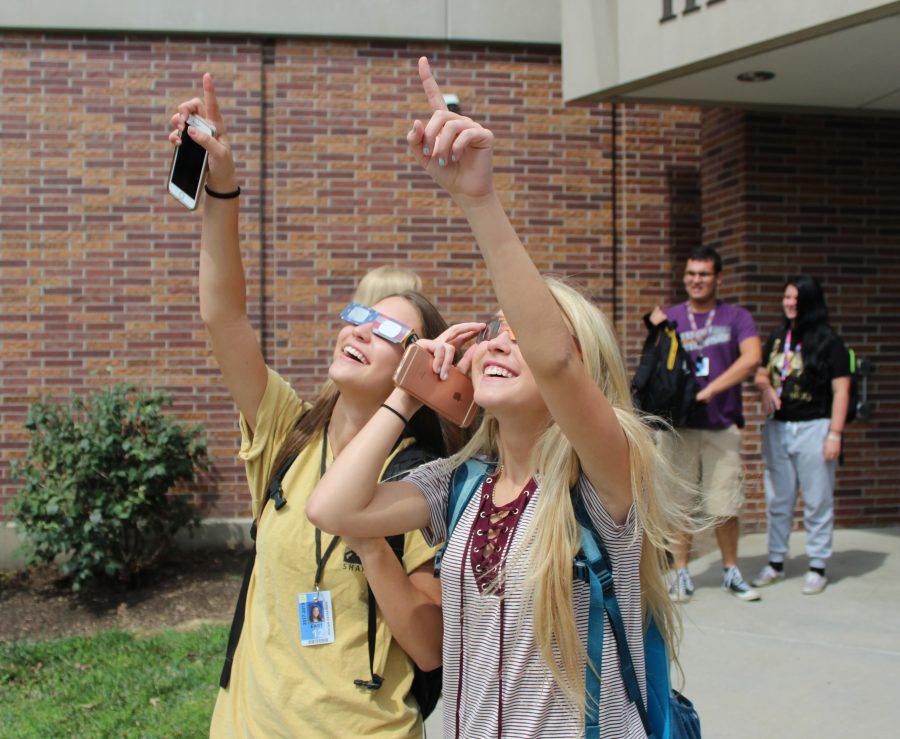 Two East high senior watch in awe at the start of the eclipse on Monday August 21. All LPS schools took a break to watch the memorable event.
Photo by Nick Rippe