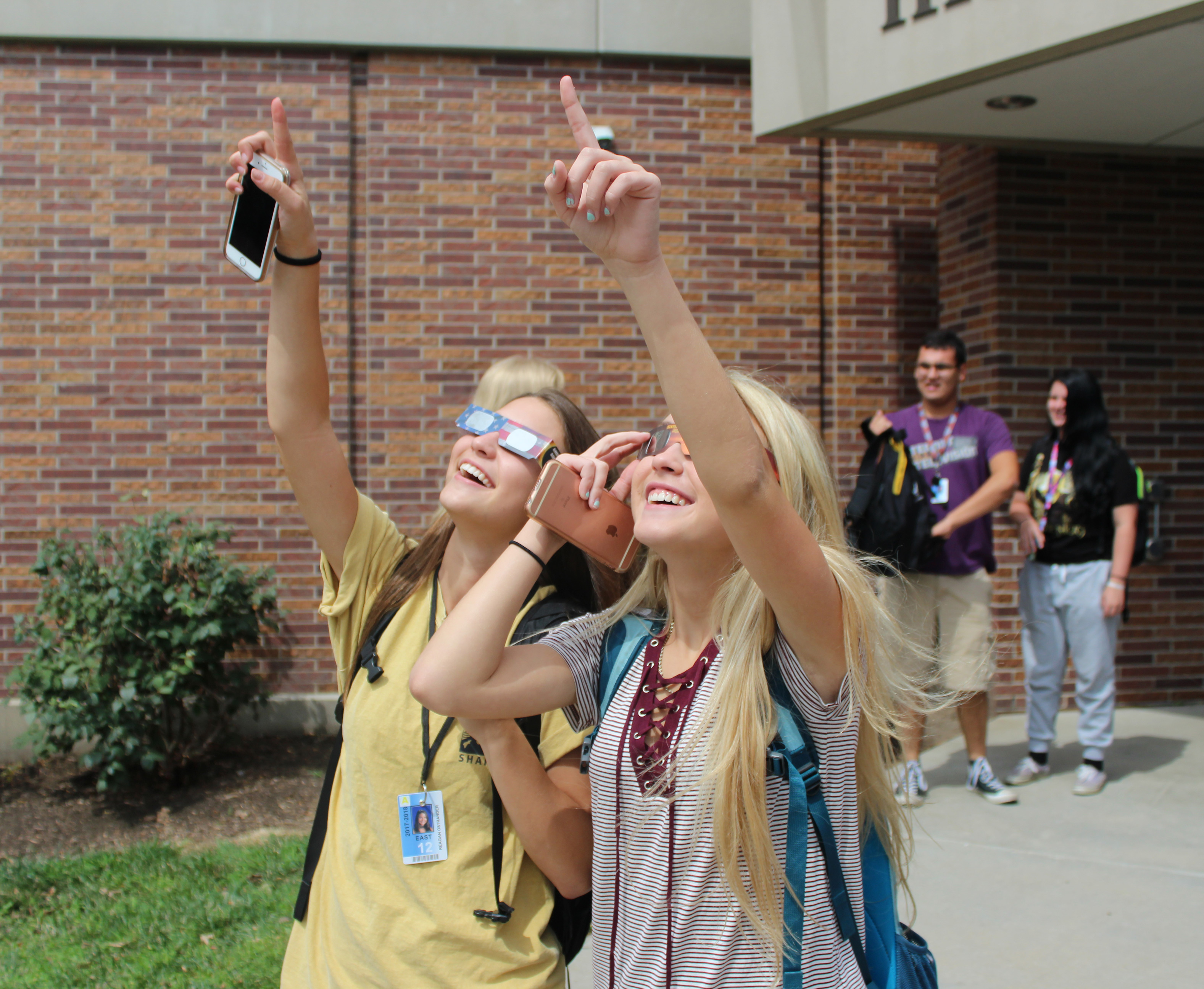 Two East high senior watch in awe at the start of the eclipse on Monday August 21. All LPS schools took a break to watch the memorable event.
Photo by Nick Rippe