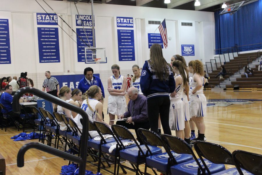 Easts girls JV team, call a time out and discuss a play during their game.