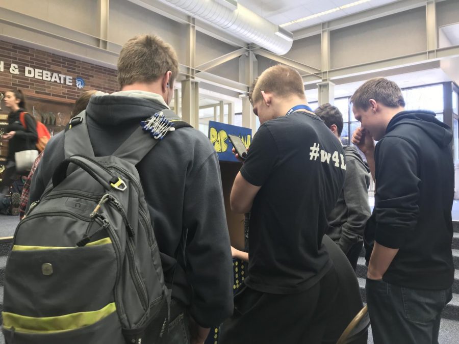 A group of East students gather around the Pacman tower to watch a game on March 2, 2018, in the commons. 