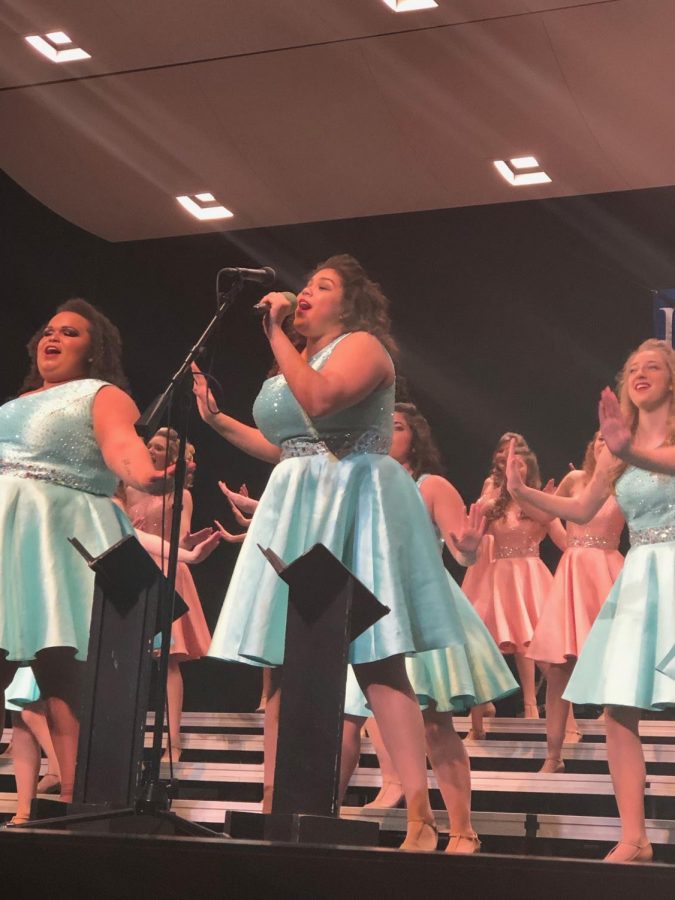 East High’s Elegance first soloist Celeste Hellbusch singing at in the exhibition performance at Spartan Spectacular on Saturday, January 26.