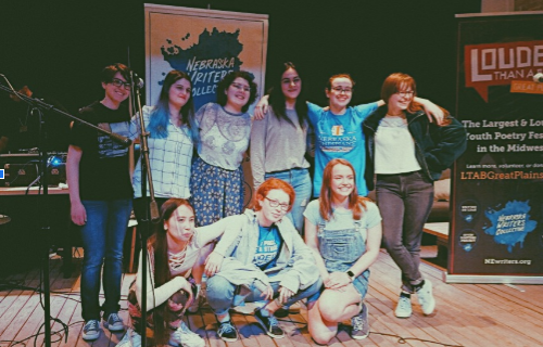 The Lincoln East Slam Poetry team poses at their recent competition at The Bay in Lincoln.