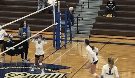 The Spartan Volleyball team must wear masks while practicing as well as playing
