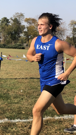 Pushing to the finish line, Graeme Hepburn stays focused for the grand achievement of running a 5k.
