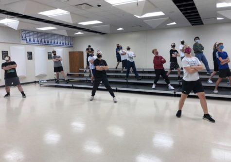 Boys show choir doing a finishing pose to one of their songs.