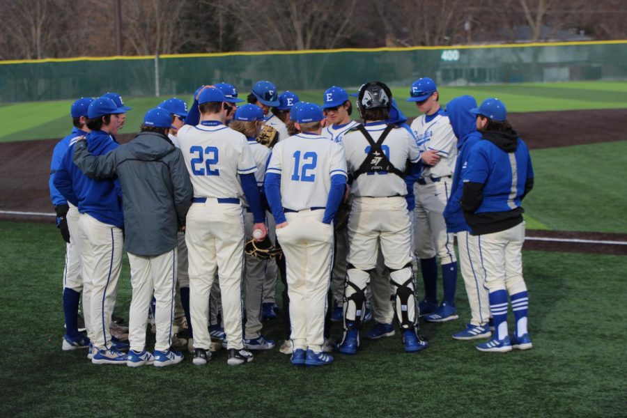The+Lincoln+East+Varsity+Baseball+team+huddles+together+on+Opening+day+March+18th%2C+2022