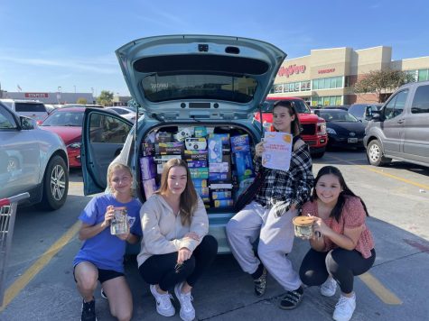 Lincoln Easts Feminist club gathers products at their feminine hygiene drive at Hyvee.
