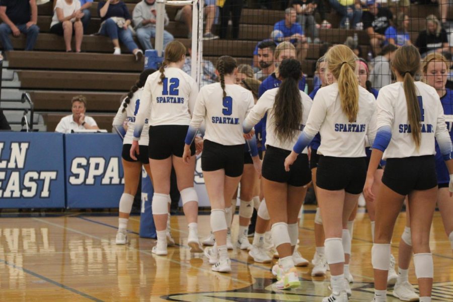 The Spartans shook hands following the game against the Kearney Bearcats on September 27, 2022. They won all three sets.