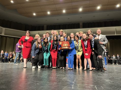 Lincoln East Speech team poses with the Class A state title on March 15, 2023 in Kearney, NE. East edged out 6 time defending champion Millard North  240-192 to earn their 34th state title in school history.