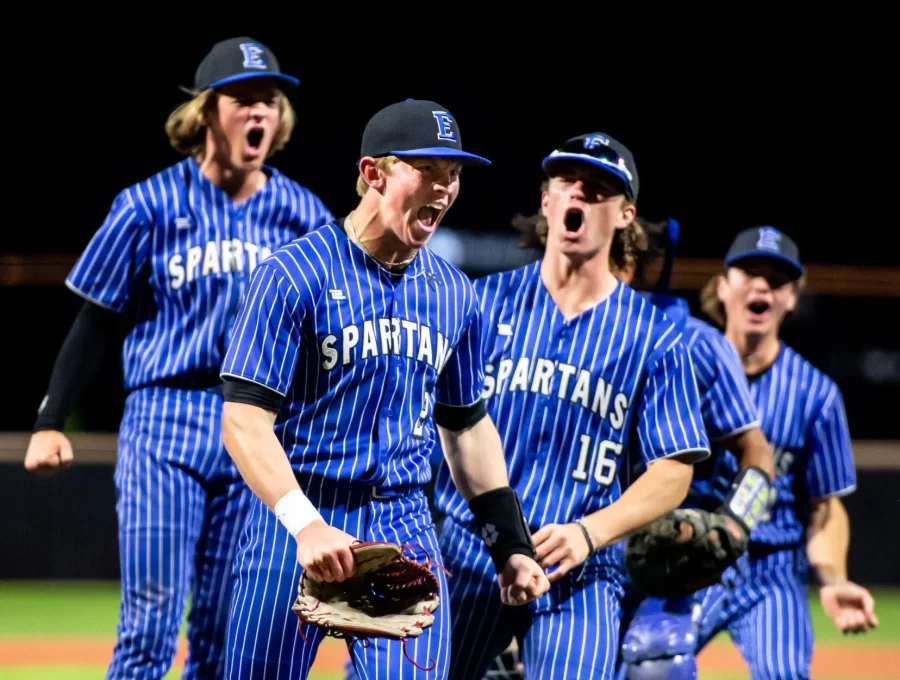 The+Lincoln+East+Baseball+team+ended+a+46-year+drought+by+capturing+the+state+baseball+title+on+Friday+May+19th%2C+2023+at+UNOs+Tal+Anderson+Field.+%28L-R%29+Tanner+Peterson%2C+Landon+Sandy+%2816%29+and+Kai+Burkey+celebrate+with+Troy+Peltz+%282%29+after+he+threw+out+a+runner+at+home+to+save+the+game+in+the+bottom+of+the+7th+inning.