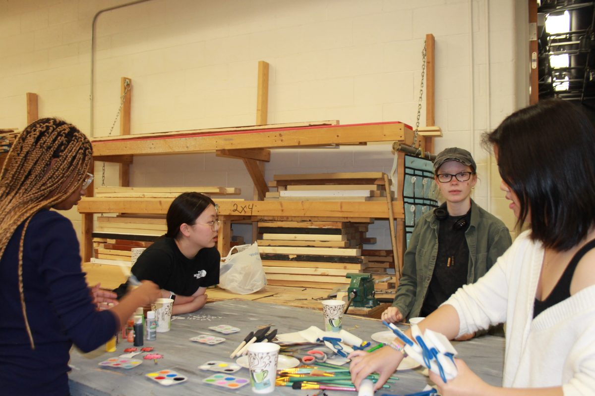 (L-R) Raiyn Elerson , Joanna Ou, Emily Schmersal, and Kipkip Hung paint trees for the set of The Seussical in the Black Box. The painting process is very lengthy and not for the most patient people.