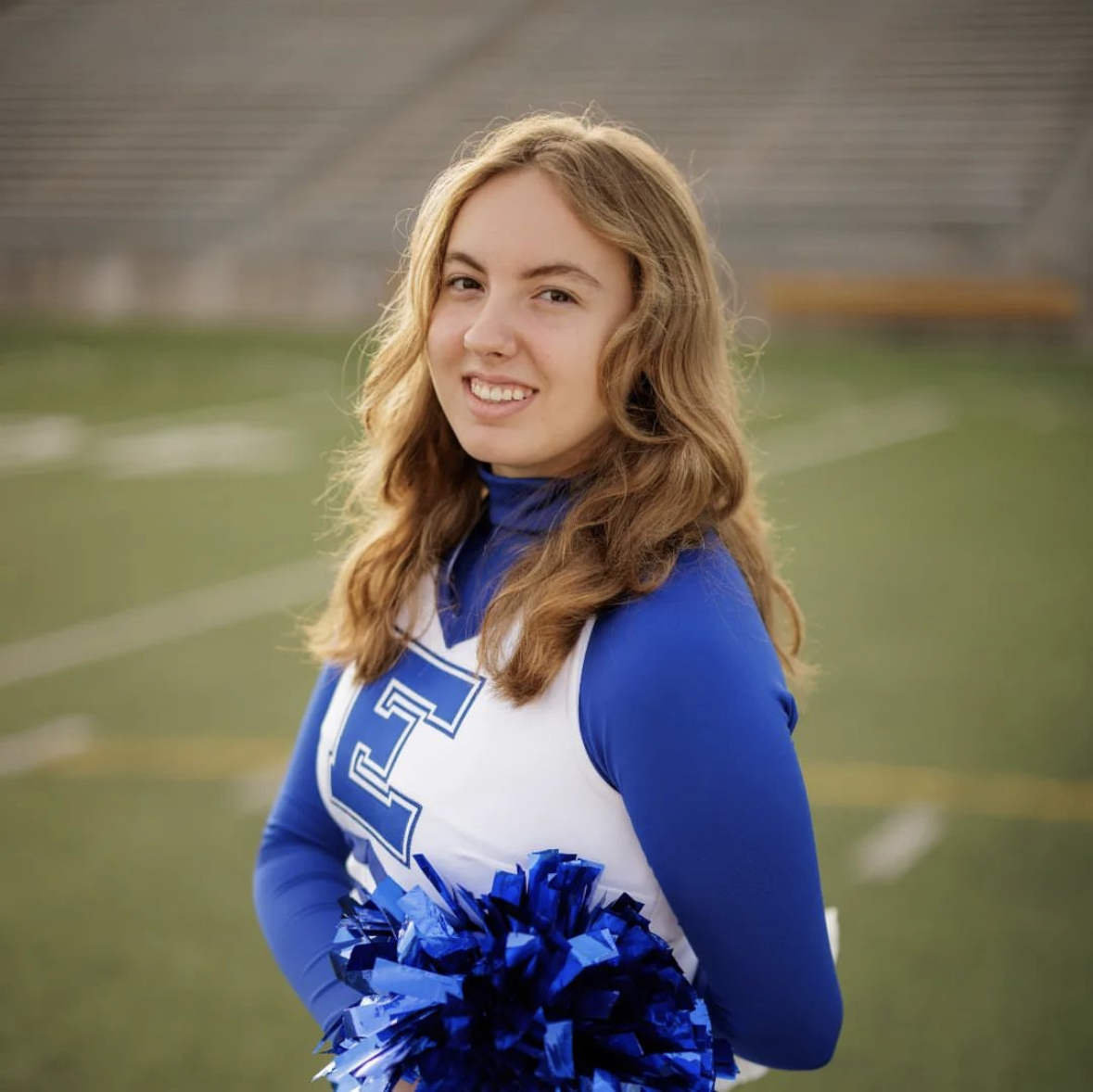 Hannah Borrell poses for the varsity cheerleaders photo-shoot in early September of 2023. Shes a senior on the cheer team whos writing her own fantasy novel.