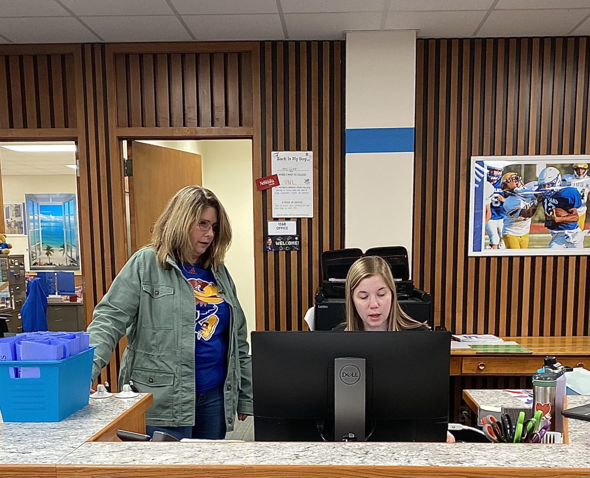 Featured left to right, Pam Kolbe and Abby Lott, Easts media technician and school librarian working at the library front desk, October 5, 2023. All three library staff are available and working throughout the school day, and can be found at Easts library front desk.