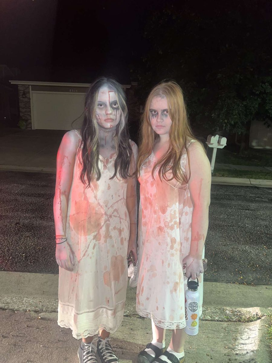 (L-R) Anah Lee and Olivia Hussey in their costumes on September 23rd, 2023 for their first night of scaring at Roca Scary Farm. They are dressed up as dead people.