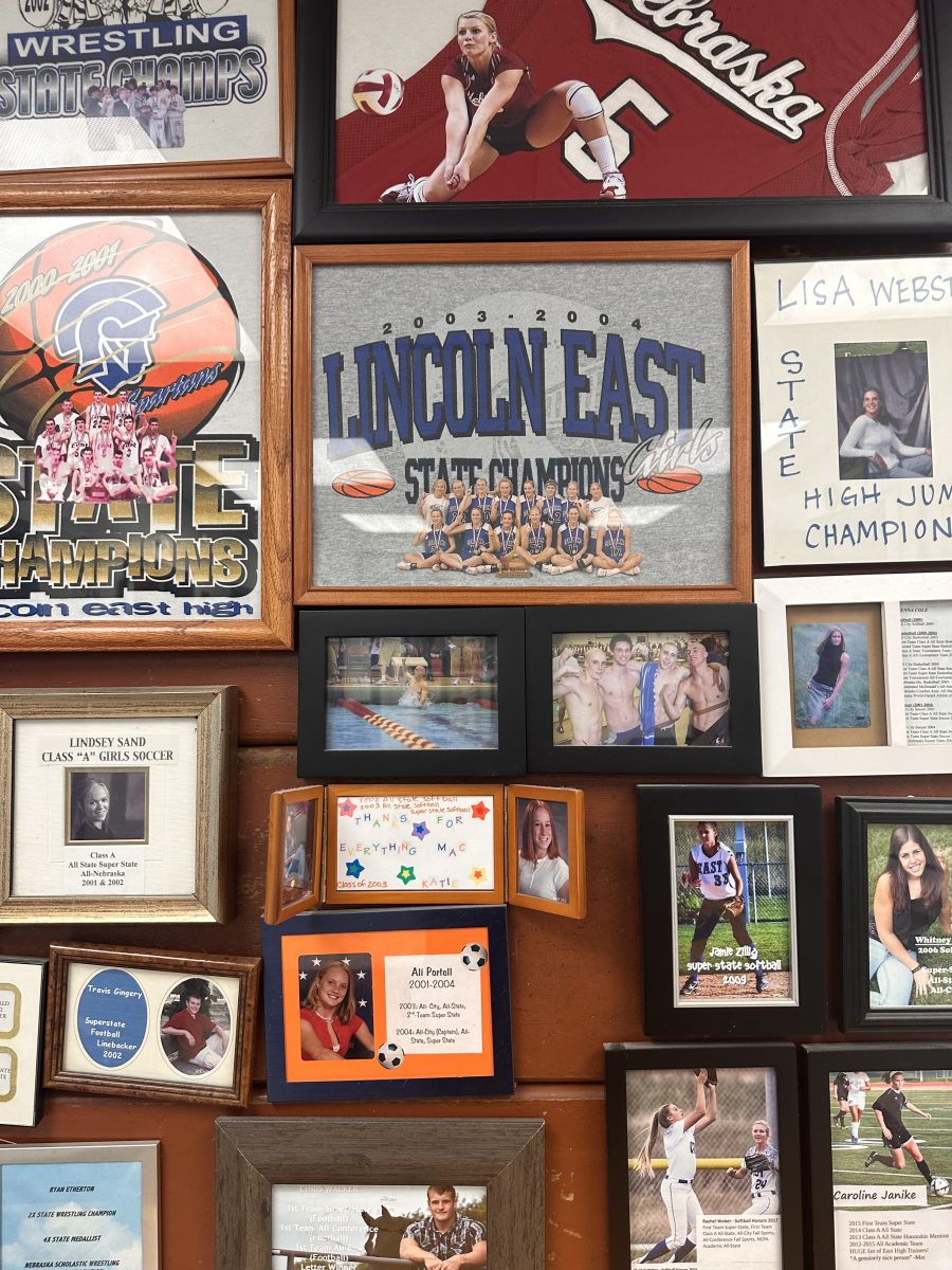 Framed shirts, team picture cutouts, and posters fill the walls of the East training room. Not only do these posters demonstrate the success of East teams, the represent the hard work of the trainers that kept these athletes healthy.