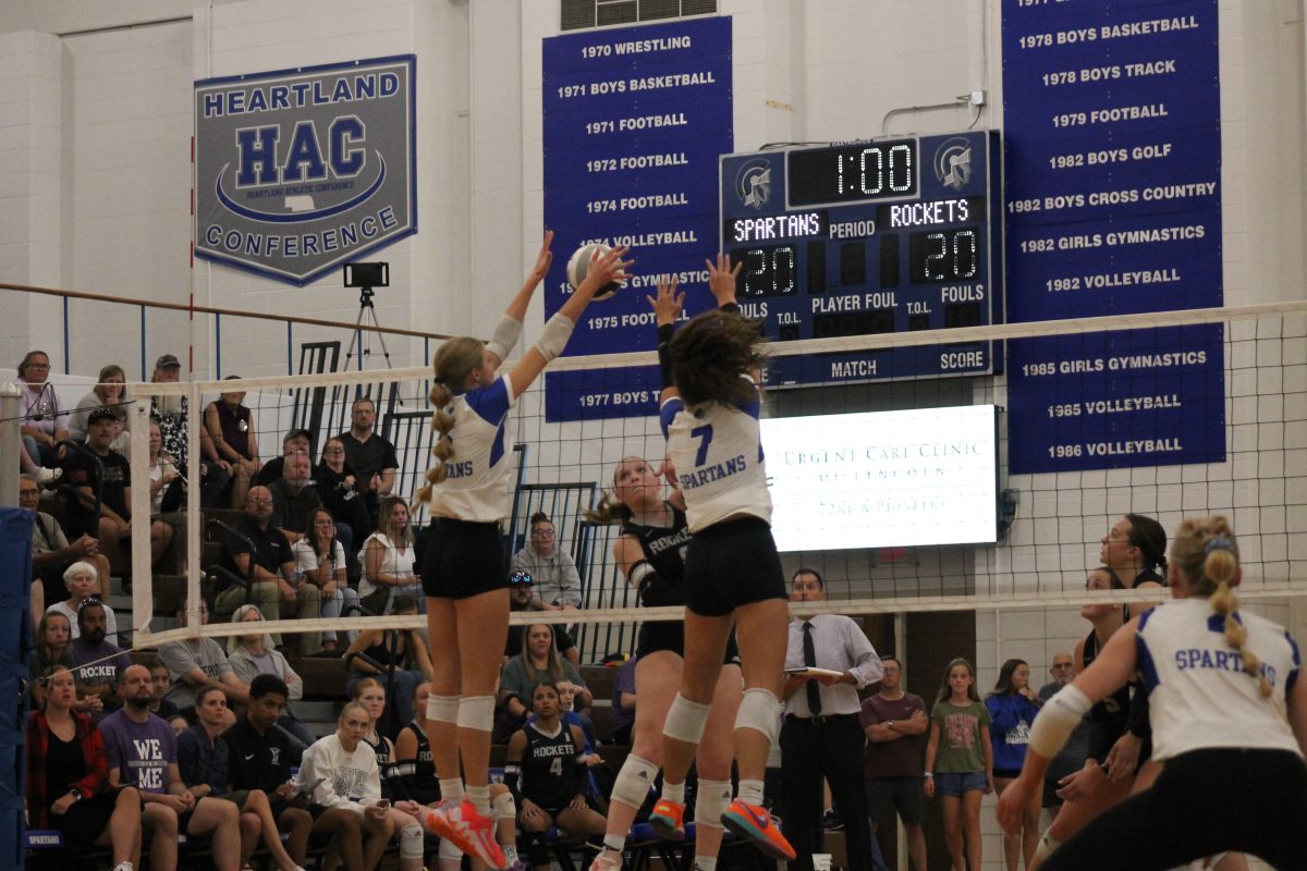 Sammi Plas (left) and Katie Merten (right) went up for a double block with a tied score in their game against Northeast on Tuesday September 17, 2024. The Spartans ended up losing to the Rockets with a final score of 3-1.