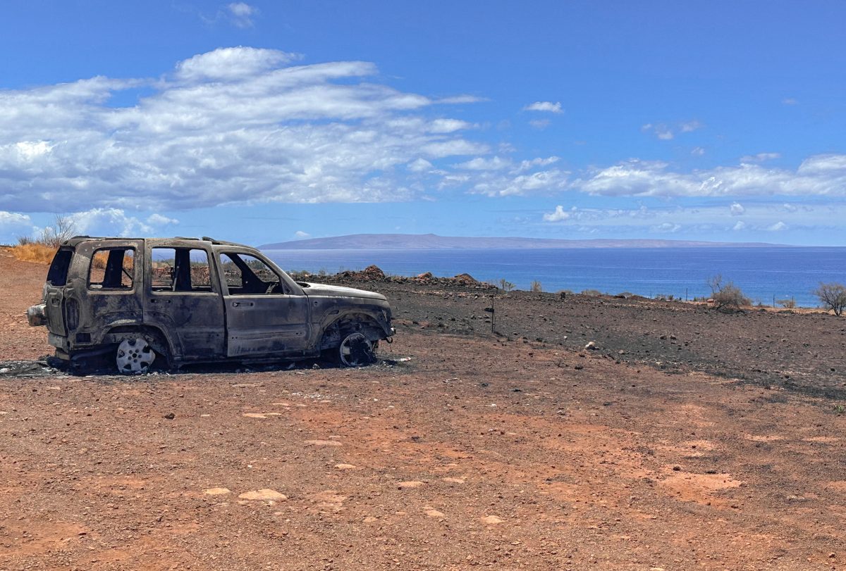 A car left during the Lahaina fires overlooks the ocean in Maui, Hawaii after the devastating fires that took place during August 2023. Lots of locals lost all personal belongings, leaving only ash. 