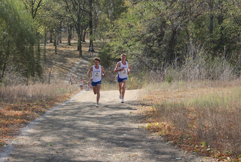 Senior Caleb Ruch (R), and junior Ben Schlegelmilch lead the race early on in the District Meet. They have been working together all year to be the best they can.