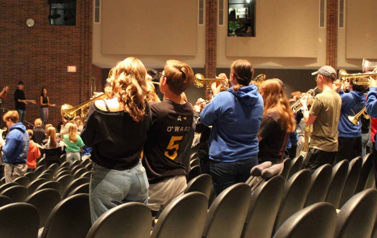 Lincoln East's marching band practices performance in the auditorium before State. They worked hard during rehearsal to perfect their set of music.