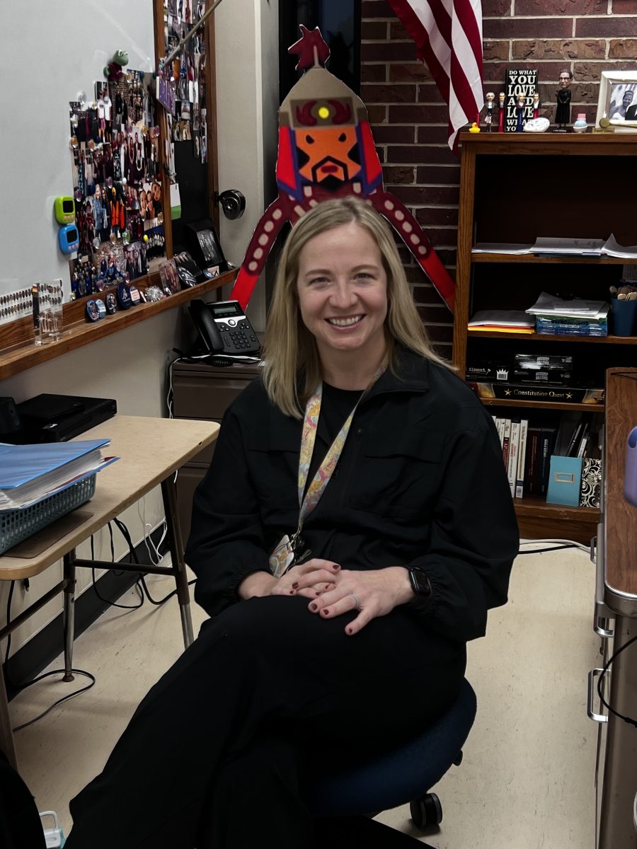 Michaela Schleicher, a teacher at Lincoln East, sits in her classroom preparing for the challenges of the new positions this year. Surrounded by pictures and other memories, she is reminded of her teaching journey.