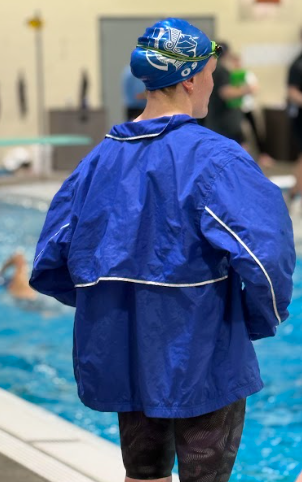 Junior Kate Ost reflects on her race after competing and becoming a Heartland Athletic Conference champion at the Freemont YMCA, on Saturday, February 15. The girls 200 yard freestyle relay not only won, but also set a new school record with a team consisting of Kate Ost, Maggie Kontras, Kayla Wischhof, and Avari Wischhof.