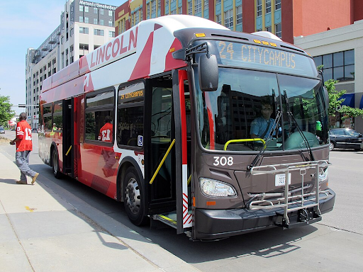 A StarTran bus in Lincoln, Nerbaska, picks up passengers downtown as it runs the City Campus route. On May 27, 2015 a bus arrived on the north side of Q Street patiently waiting for more passengers to board.