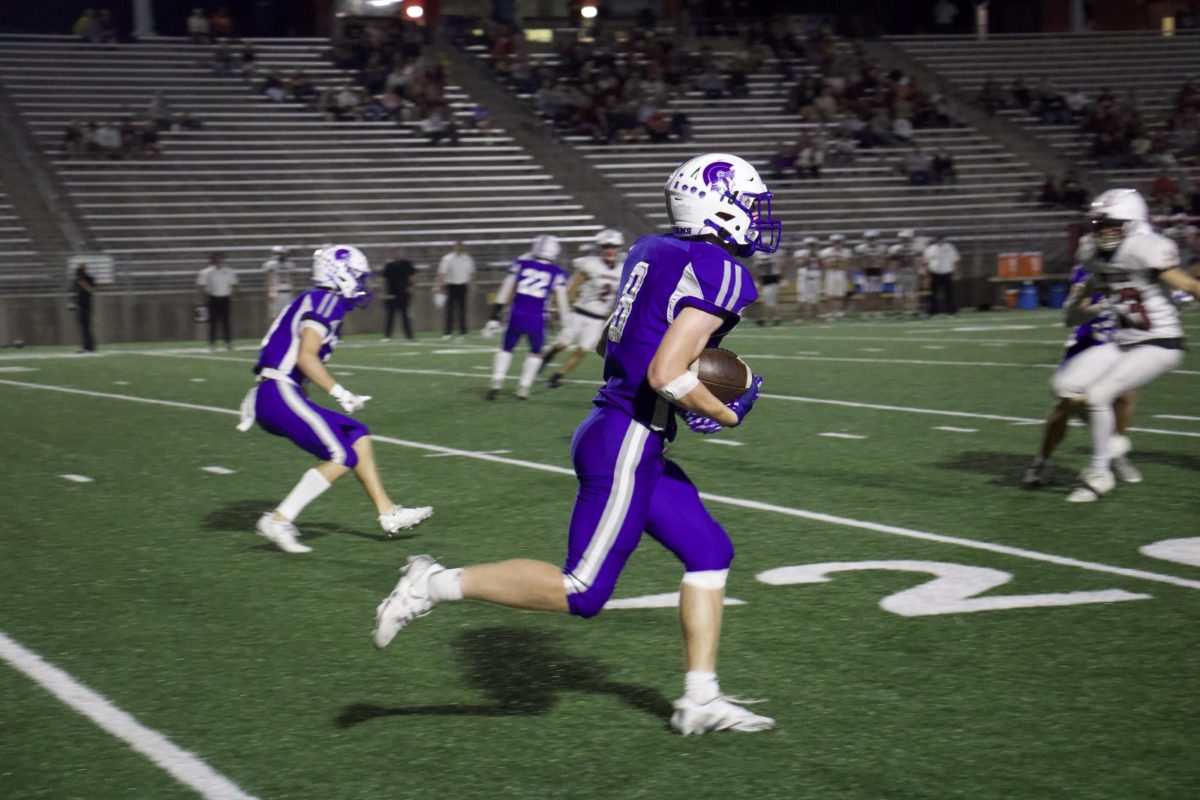 On October 9, 2025, the Lincoln East Spartans played against Columbus High School at Seacrest Field. Landen Lingenfelter (8) was captured running the ball as a senior wide receiver.